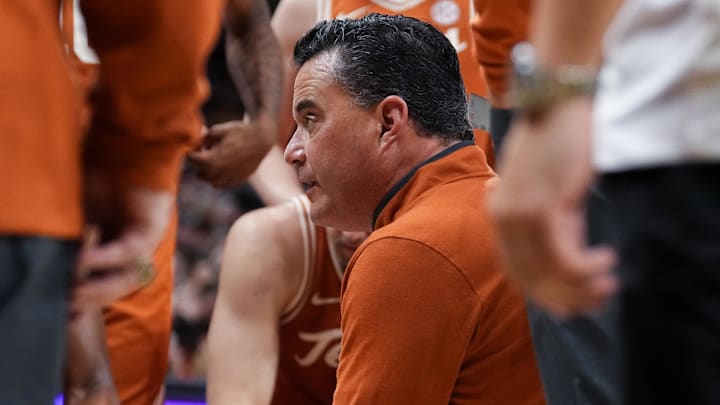 Texas Longhorns head coach Sean Miller talks with players in a time out against the Missouri Tigers.