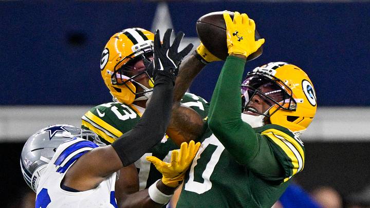 Green Bay Packers wide receiver Matthew Golden (0) catches a pass over Dallas Cowboys cornerback DaRon Bland.
