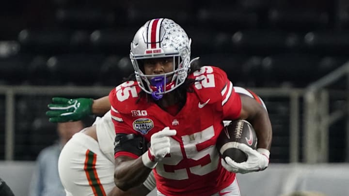 Dec 31, 2025; Arlington, TX, USA; Ohio State Buckeyes running back Bo Jackson (25) carries the ball against the Miami Hurricanes during the second half of 2025 Cotton Bowl and quarterfinal game of the College Football Playoff at AT&T Stadium. Mandatory Credit: Raymond Carlin III-Imagn Images