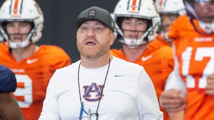 Auburn Tigers head coach Alex Golesh talks with his team during practice at Woltosz Football Performance Center in Auburn, Ala. on Thursday, April 16, 2026.