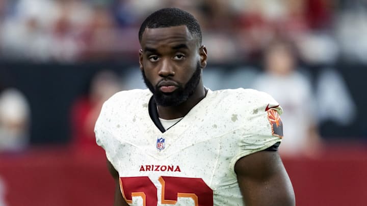 Sep 25, 2025; Glendale, Arizona, USA; Arizona Cardinals running back Trey Benson (33) against the Seattle Seahawks at State Farm Stadium. Mandatory Credit: Mark J. Rebilas-Imagn Images
