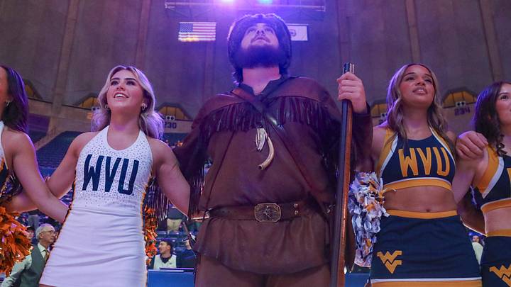 Dec 3, 2025; Morgantown, West Virginia, USA; The West Virginia Mountaineers mascot sings “Country Roads” after defeating the Coppin State Eagles at Hope Coliseum. Mandatory Credit: Ben Queen-Imagn Images Dec 3, 2025; Morgantown, West Virginia, USA; The West Virginia Mountaineers mascot sings “Country Roads” after defeating the Coppin State Eagles at Hope Coliseum. Mandatory Credit: Ben Queen-Imagn Images