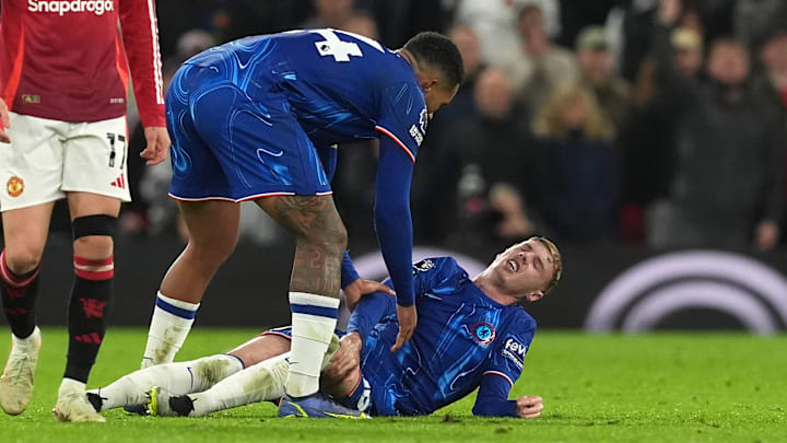 Palmer (right) on the ground in pain after stoppage time foul from Lisandro Martinez.