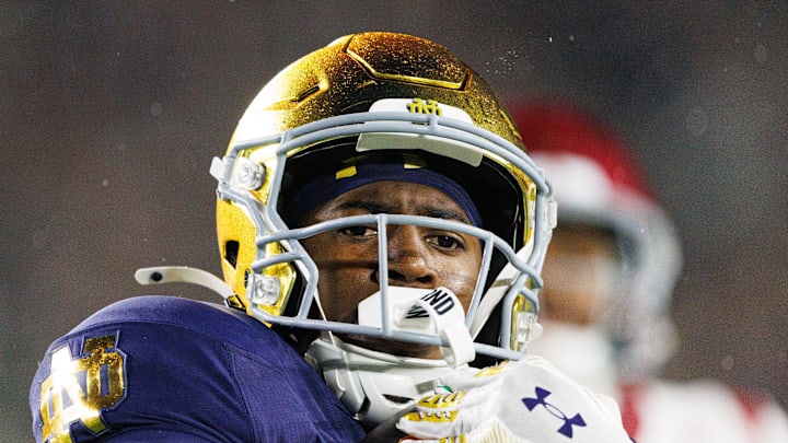 Notre Dame running back Jadarian Price returns a kick for a touchdown in the second half of a NCAA football game.