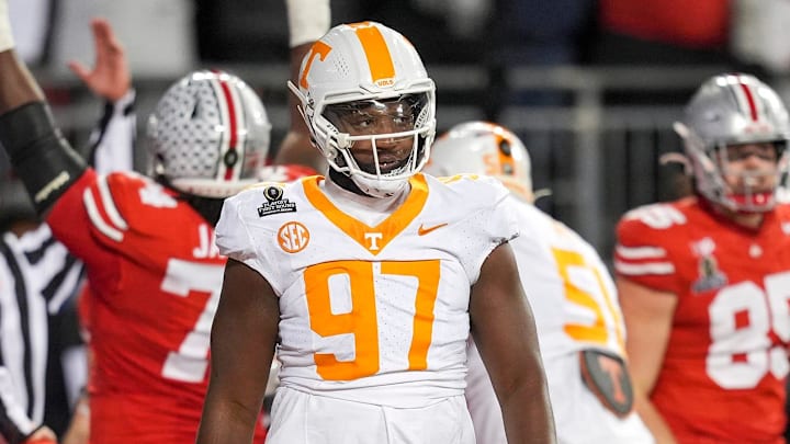 Tennessee defensive lineman Jayson Jenkins (97) and Tennessee defensive lineman James Pearce Jr. (27) walk off after Ohio State scores a touchdown in the final minutes of the third quarter during a College Football Playoff first round game between Tennessee and Ohio State held at Ohio Stadium in Columbus, Ohio, on Saturday, Dec. 21, 2024.