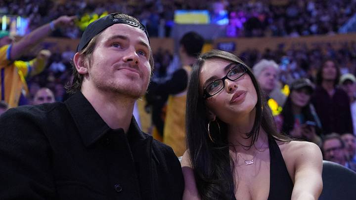 Oct 24, 2025; Los Angeles, California, USA; Los Angeles Chargers quarterback Justin Herbert (left) and pop star Madison Beer on a date to watch the game between the Minnesota Timberwolves and the Los Angeles Lakers at Crypto.com Arena. Mandatory Credit: Kirby Lee-Imagn Images