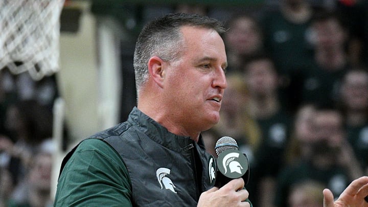 Dec 2, 2025; East Lansing, Michigan, USA; Michigan State head football coach Pat Fitzgerald watches the Spartans defeat the Iowa Hawkeyes at Jack Breslin Student Events Center. Mandatory Credit: Dale Young-Imagn Images Dec 2, 2025; East Lansing, Michigan, USA; Michigan State head football coach Pat Fitzgerald watches the Spartans defeat the Iowa Hawkeyes at Jack Breslin Student Events Center. Mandatory Credit: Dale Young-Imagn Images