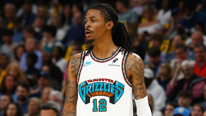 Apr 18, 2025; Memphis, Tennessee, USA; Memphis Grizzlies guard Ja Morant (12) looks on during the second quarter against the Dallas Mavericks at FedExForum. Mandatory Credit: Petre Thomas-Imagn Images