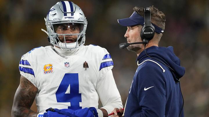 Dallas Cowboys QB Dak Prescott talks with head coach Brian Schottenheimer during the game against the Green Bay Packers. Dallas Cowboys QB Dak Prescott talks with head coach Brian Schottenheimer during the game against the Green Bay Packers.