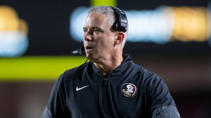 Florida State Seminoles head coach Mike Norvell talks into his headset during a timeout. The Florida State Seminoles defeated the New Mexico State Aggies 34-17 at Doak Campbell Stadium on Saturday, Aug. 29, 2026.