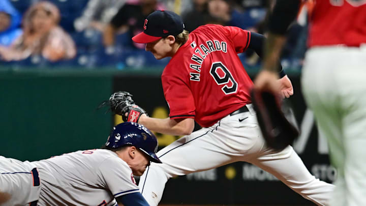Sep 28, 2024; Cleveland, Ohio, USA; Cleveland Guardians first baseman Kyle Manzardo (9) forces out Houston Astros designated hitter Zach Dezenzo (9) during the ninth inning at Progressive Field. Mandatory Credit: Ken Blaze-Imagn Images Sep 28, 2024; Cleveland, Ohio, USA; Cleveland Guardians first baseman Kyle Manzardo (9) forces out Houston Astros designated hitter Zach Dezenzo (9) during the ninth inning at Progressive Field. Mandatory Credit: Ken Blaze-Imagn Images