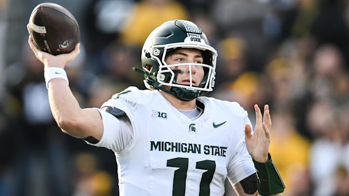 Nov 22, 2025; Iowa City, Iowa, USA; Michigan State Spartans quarterback Alessio Milivojevic (11) throws a pass against the Iowa Hawkeyes during the first quarter at Kinnick Stadium. Mandatory Credit: Jeffrey Becker-Imagn Images