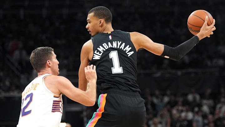 Feb 19, 2026; Austin, Texas, USA; San Antonio Spurs forward Victor Wembanyama (1) prepares to drives to the basket against Phoenix Suns guard Collin Gillespie (12) during the first half against the Phoenix Suns at Moody Center. Mandatory Credit: Scott Wachter-Imagn Images