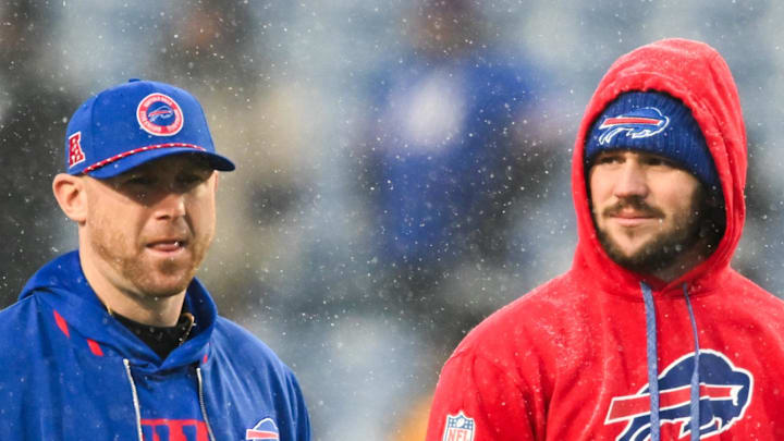 Buffalo Bills quarterback Josh Allen speaks with Buffalo Bills Offensive Coordinator Joe Brady.