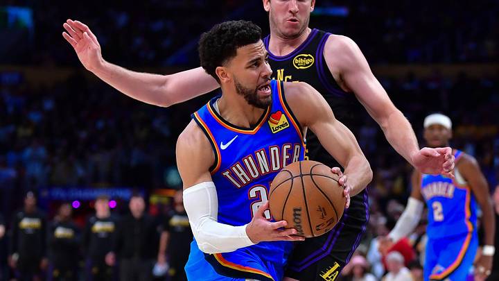 May 11, 2026; Los Angeles, California, USA; Oklahoma City Thunder guard Ajay Mitchell (25) moves to the basket against Los Angeles Lakers guard Austin Reaves (15) during the second half in game four of the second round of the 2026 NBA Playoffs at Crypto.com Arena. Mandatory Credit: Gary A. Vasquez-Imagn Images
