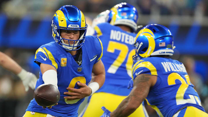 Nov 11, 2024; Inglewood, California, USA; Los Angeles Rams quarterback Matthew Stafford (9) hands the ball off to running back Kyren Williams (23) against the Miami Dolphins in the first half at SoFi Stadium. Mandatory Credit: Kirby Lee-Imagn Images Nov 11, 2024; Inglewood, California, USA; Los Angeles Rams quarterback Matthew Stafford (9) hands the ball off to running back Kyren Williams (23) against the Miami Dolphins in the first half at SoFi Stadium. Mandatory Credit: Kirby Lee-Imagn Images