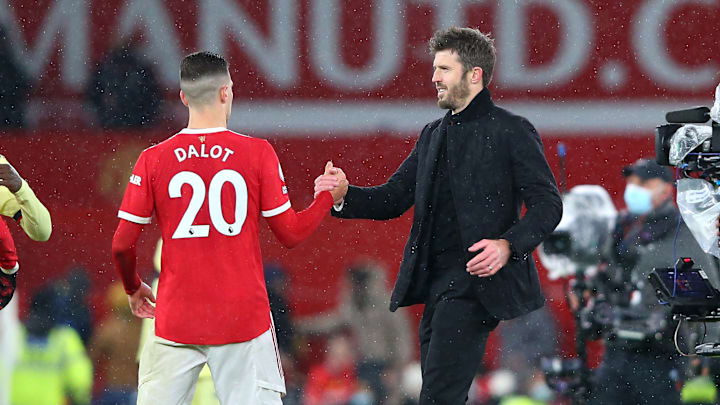 Michael Carrick congratulates Diogo Dalot