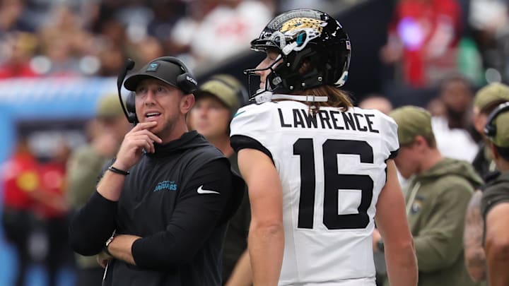 Nov 9, 2025; Houston, Texas, USA; Jacksonville Jaguars head coach Liam Coen and quarterback Trevor Lawrence (16) on the sidelines during the first half against the Houston Texans at NRG Stadium. Mandatory Credit: Thomas Shea-Imagn Images