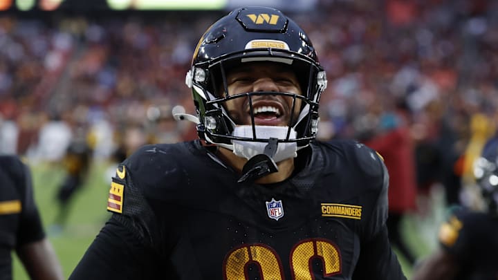 Dec 1, 2024; Landover, Maryland, USA; Washington Commanders running back Chris Rodriguez Jr. (36) celebrates after scoring a touchdown against the Tennessee Titans during the fourth quarter at Northwest Stadium. Mandatory Credit: Geoff Burke-Imagn Images