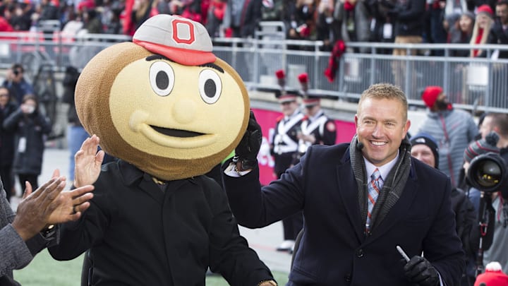 ESPN Gameday host Lee Corso puts on a Brutus Buckeye