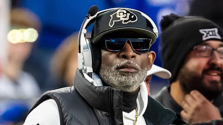 Nov 23, 2024; Kansas City, Missouri, USA;  Colorado head coach Deion Sanders watches the run of play during the 3rd quarter between the Kansas Jayhawks and the Colorado Buffaloes at GEHA Field at Arrowhead Stadium. Mandatory Credit: Nick Tre. Smith-Imagn Images