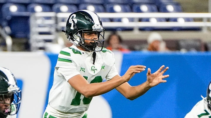 Detroit Cass Tech freshman quarterback Donald Tabron II calls for a snap against Detroit King during the first half of PSL championship at Ford Field in Detroit on Friday, Oct. 18, 2024. Offensive linemen Joshua Paramore (77) and Evan Gooden (58) prepare to block. Detroit Cass Tech freshman quarterback Donald Tabron II calls for a snap against Detroit King during the first half of PSL championship at Ford Field in Detroit on Friday, Oct. 18, 2024. Offensive linemen Joshua Paramore (77) and Evan Gooden (58) prepare to block.
