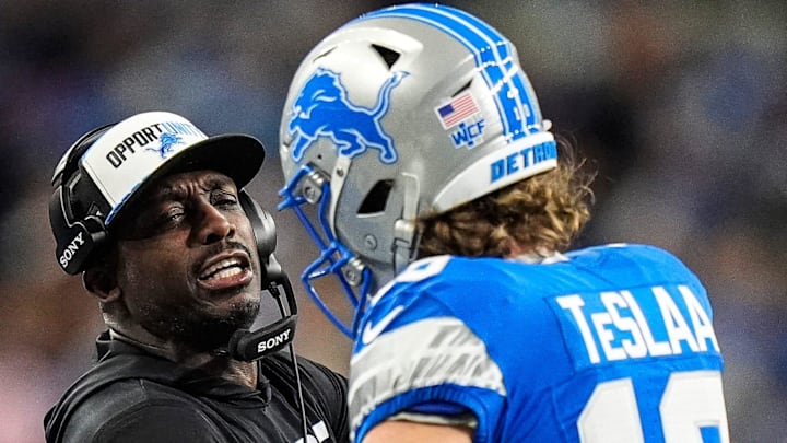 Detroit Lions wide receivers coach Scottie Montgomery celebrates a touchdown with Isaac TeSlaa (18)