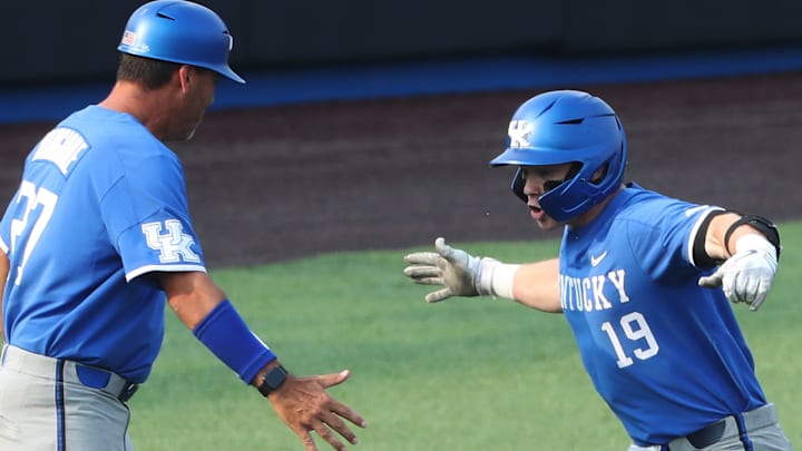 UK's Nolan McCarthy (19) is congratulated by head coach Nick Mingione (27) after a home run against Indiana during their rematch in the NCAA Regional in Lexington Ky. on June 4, 2023.