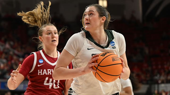 Mar 22, 2025; Raleigh, North Carolina, USA; Michigan State Spartans forward Grace VanSlooten (14) shoots against Harvard Crimson forward Abigail Wright (40) during the first half at James T. Valvano Arena at William Neal Reynolds. Mandatory Credit: William Howard-Imagn Images Mar 22, 2025; Raleigh, North Carolina, USA; Michigan State Spartans forward Grace VanSlooten (14) shoots against Harvard Crimson forward Abigail Wright (40) during the first half at James T. Valvano Arena at William Neal Reynolds. Mandatory Credit: William Howard-Imagn Images