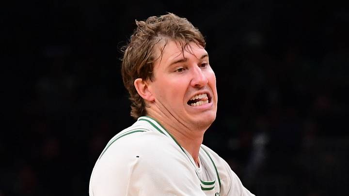 Oct 14, 2026; Boston, Massachusetts, USA;  Charlotte Hornets forward Brandon Miller (24) controls the ball while Boston Celtics guard Baylor Scheierman (55) defends during the second half at TD Garden. Mandatory Credit: Bob DeChiara-Imagn Images
