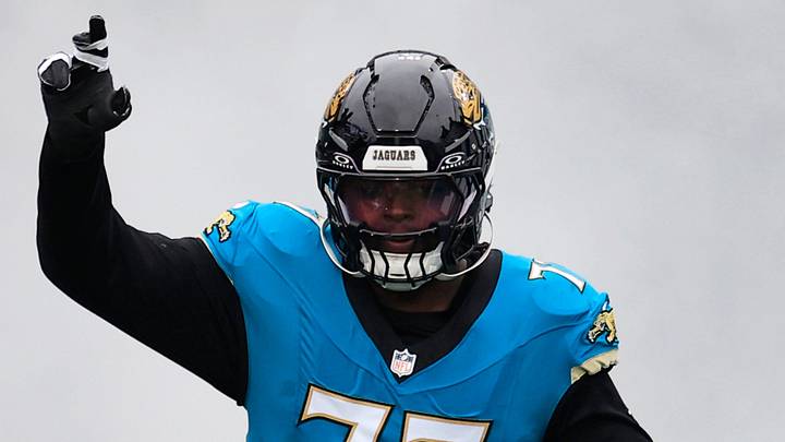 Jacksonville Jaguars offensive tackle Anton Harrison (77) runs on the field before an NFL football matchup at EverBank Stadium, Sunday, Jan. 4, 2026, in Jacksonville, Fla. The Jaguars defeated the Titans 41-7, capturing the AFC South title. 