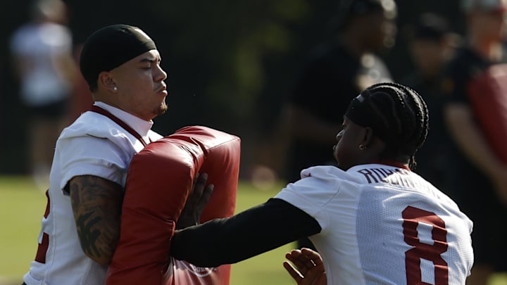 Washington Commanders running back Brian Robinson Jr. and cornerback Car'lin Vigers Washington Commanders running back Brian Robinson Jr. and cornerback Car'lin Vigers