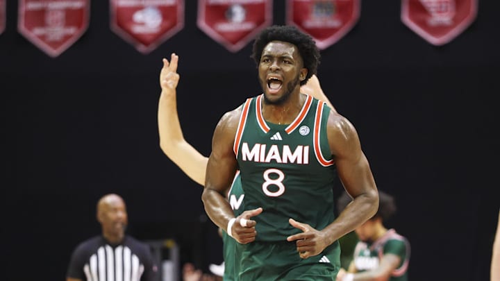 Nov 28, 2025; Kissimmee, FL, USA; Miami (FL) Hurricanes center Ernest Udeh Jr. (8) reacts after a basket against the Georgetown Hoyas in the first half during the ESPN Events Invitational at State Farm Field House. Mandatory Credit: Nathan Ray Seebeck-Imagn Images