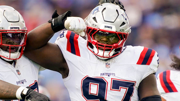 New England Patriots defensive end Milton Williams (97) celebrates sacking Tennessee Titans quarterback Cam Ward (1) during the third quarter at Nissan Stadium in Nashville, Tenn., Sunday, Oct. 19, 2025.
