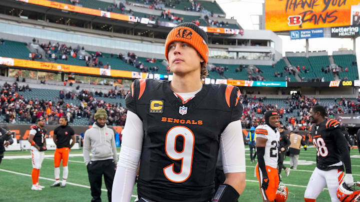 Cincinnati Bengals quarterback Joe Burrow (9) looks for hands to shake after the fourth quarter of the NFL Week 18 game between the Cincinnati Bengals and the Cleveland Browns at Paycor Stadium in Downtown Cincinnati.