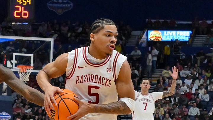 Mar 15, 2026; Nashville, TN, USA; Arkansas Razorbacks guard Darius Acuff Jr. (5) drives to the basket as Vanderbilt Commodores guard Tyler Tanner (3) defends during the men's SEC Conference Tournament Championship at Bridgestone Arena. Mandatory Credit: Steve Roberts-Imagn Images Mar 15, 2026; Nashville, TN, USA; Arkansas Razorbacks guard Darius Acuff Jr. (5) drives to the basket as Vanderbilt Commodores guard Tyler Tanner (3) defends during the men's SEC Conference Tournament Championship at Bridgestone Arena. Mandatory Credit: Steve Roberts-Imagn Images