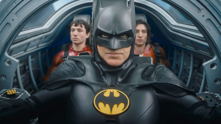 (L-R) EZRA MILLER as The Flash, MICHAEL KEATON as Batman and EZRA MILLER as The Flash in Warner Bros. Pictures’ action adventure “THE FLASH,” a Warner Bros. Pictures release. Courtesy of Warner Bros. Pictures/™ & © DC Comics. © 2023 Warner Bros. Ent. All Rights Reserved. TM & © DC