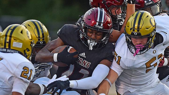 Gadsden City’s Amir Thomas tries to evade the tackle of an Oxford defenders during high school football action in Gadsden, Alabama August 21, 2026. Gadsden City’s Amir Thomas tries to evade the tackle of an Oxford defenders during high school football action in Gadsden, Alabama August 21, 2026.