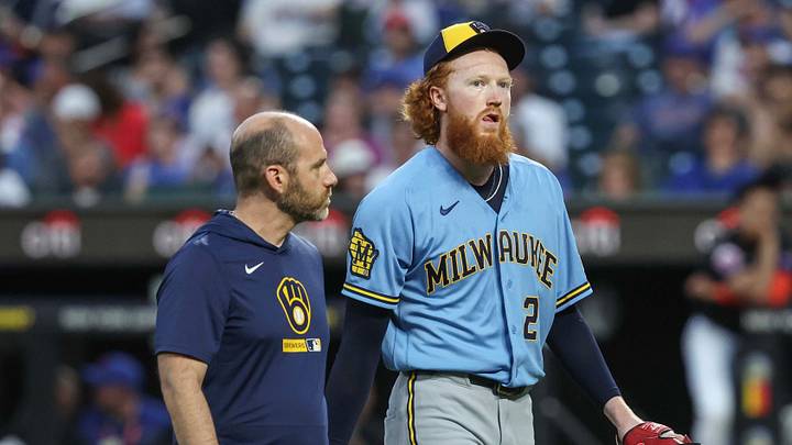 Aug 26, 2026; New York City, New York, USA;  Milwaukee Brewers starting pitcher Dustin May (21) is taken out of the game after getting hit by a line drive in the first inning against the New York Mets at Citi Field.  Mandatory Credit: Wendell Cruz-Imagn Images