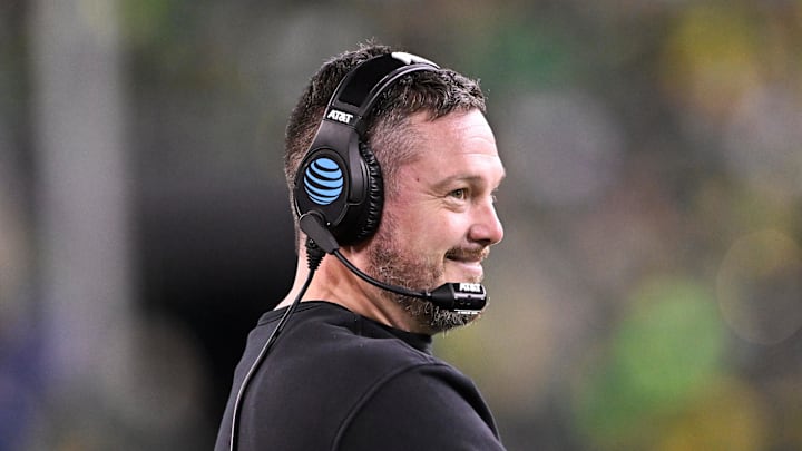 Dec 20, 2025; Eugene, OR, USA; Oregon Ducks head coach Dan Lanning smiles during the third quarter against the James Madison Dukes at Autzen Stadium. Dec 20, 2025; Eugene, OR, USA; Oregon Ducks head coach Dan Lanning smiles during the third quarter against the James Madison Dukes at Autzen Stadium.