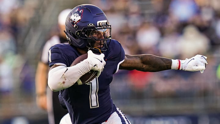Sep 20, 2025; East Hartford, Connecticut, USA; Connecticut Huskies wide receiver Skyler Bell (1) runs the ball against et Ball State Cardinals in the second half at Pratt & Whitney Stadium at Rentschler Field. Mandatory Credit: David Butler II-Imagn Images