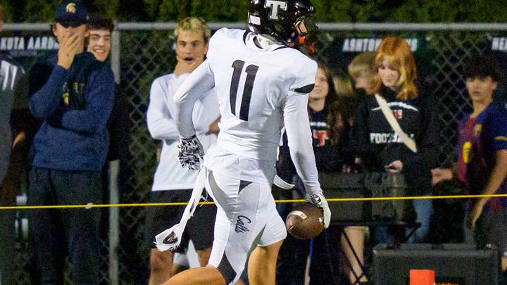 Thurston's Leofatu Filipe finishes off a 73-yard pick-six return against Sheldon on Friday. The Timberwolves climbed five spots in this week's Oregon state rankings, to No. 7.