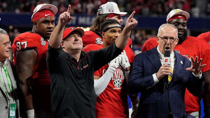 Georgia coach Kirby Smart celebrates with his team after the winning the SEC championship game against Texas in Atlanta, on Saturday, Dec. 7, 2024. Georgia won 22-19.