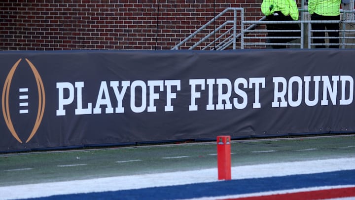 Dec 20, 2025; Oxford, MS, USA; College Football First Round logo on field prior to the game between the Tulane Green Wave and  the Mississippi Rebels at Vaught-Hemingway Stadium. Mandatory Credit: Petre Thomas-Imagn Images