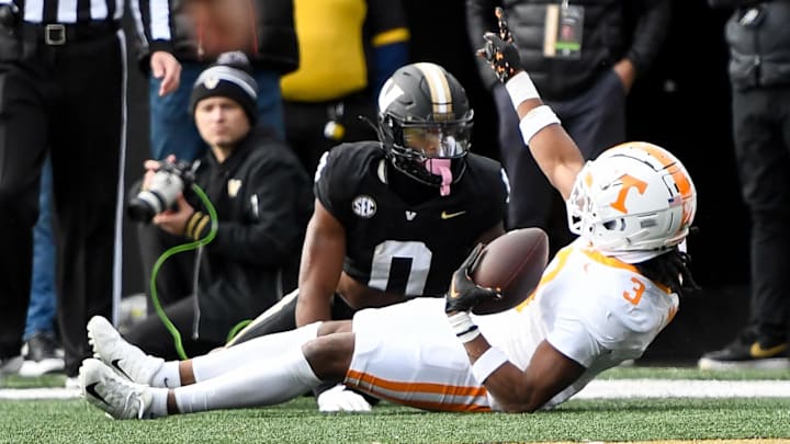 Nov 30, 2024; Nashville, Tennessee, USA;  Tennessee Volunteers defensive back Jermod McCoy (3) intercepts the pass thrown to Vanderbilt Commodores wide receiver Junior Sherrill (0) during the first half at FirstBank Stadium