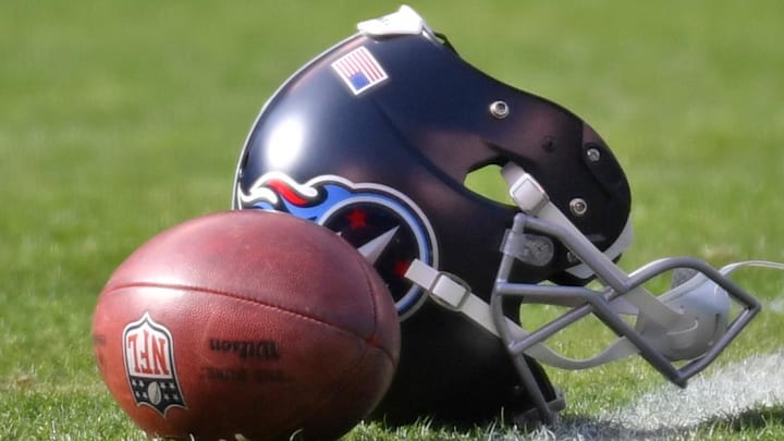 Dec 4, 2022; Philadelphia, Pennsylvania, USA; A Tennessee Titans helmet and football lay on the field during warmups against the Philadelphia Eagles at Lincoln Financial Field. Mandatory Credit: Eric Hartline-Imagn Images Dec 4, 2022; Philadelphia, Pennsylvania, USA; A Tennessee Titans helmet and football lay on the field during warmups against the Philadelphia Eagles at Lincoln Financial Field. Mandatory Credit: Eric Hartline-Imagn Images