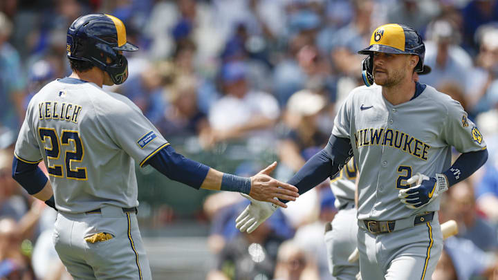 Aug 21, 2025; Chicago, Illinois, USA; Milwaukee Brewers second baseman Brice Turang (2) celebrates with designated hitter Christian Yelich (22) after hitting a two-run home run against the Chicago Cubs during the second inning at Wrigley Field. Mandatory Credit: Kamil Krzaczynski-Imagn Images Aug 21, 2025; Chicago, Illinois, USA; Milwaukee Brewers second baseman Brice Turang (2) celebrates with designated hitter Christian Yelich (22) after hitting a two-run home run against the Chicago Cubs during the second inning at Wrigley Field. Mandatory Credit: Kamil Krzaczynski-Imagn Images