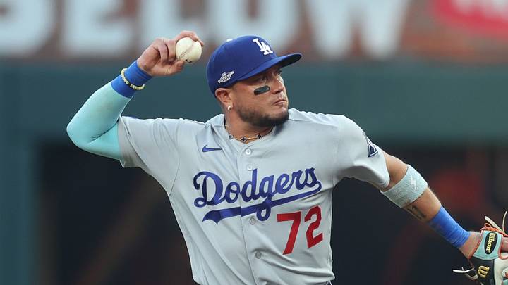 Oct 6, 2026; Cumberland, Georgia, USA;  ]Los Angeles Dodgers second baseman Miguel Rojas (72) throws to first base for an out against the Atlanta Braves during the first inning in game three of the NLDS for the 2026 MLB Playoffs at Truist Park.  Mandatory Credit: Brett Davis-Imagn Images