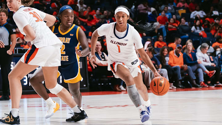 Illinois guard Aaliyah Guyton (1) dribbles off a screen from teammate Cearah Parchment (30) during the Illini's 84-64 win over Murray State on Tuesday at the State Farm Center in Champaign, Illinois.