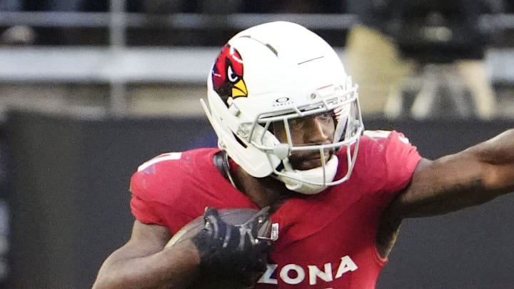 Arizona Cardinals running back Bam Knight (20) runs the ball against Los Angeles Rams linebacker Omar Speights (48) in the first half at State Farm Stadium on Dec 7, 2025, in Glendale, Ariz. Arizona Cardinals running back Bam Knight (20) runs the ball against Los Angeles Rams linebacker Omar Speights (48) in the first half at State Farm Stadium on Dec 7, 2025, in Glendale, Ariz.